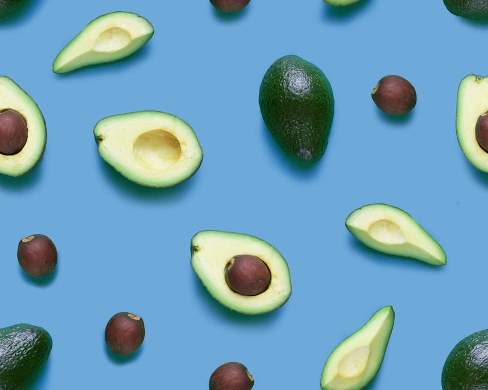 avacados on blue background