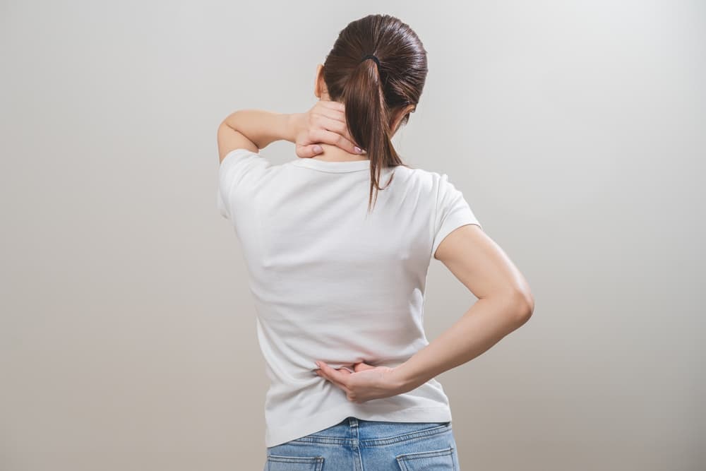 woman with neck and back pain